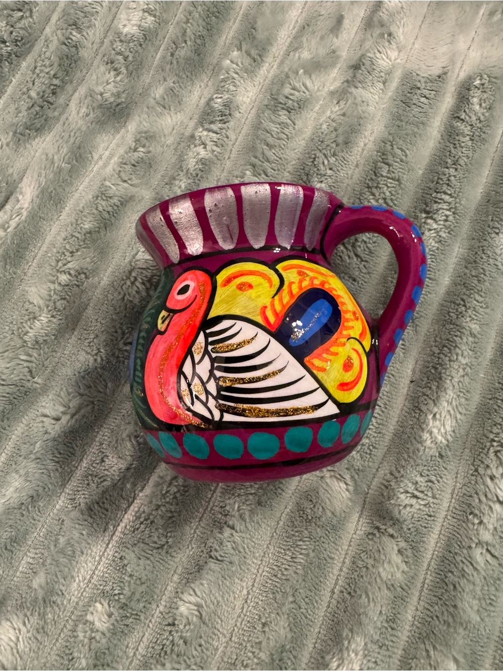 Hand-Painted Purple Ceramic Pitcher with Colorful Bird Design